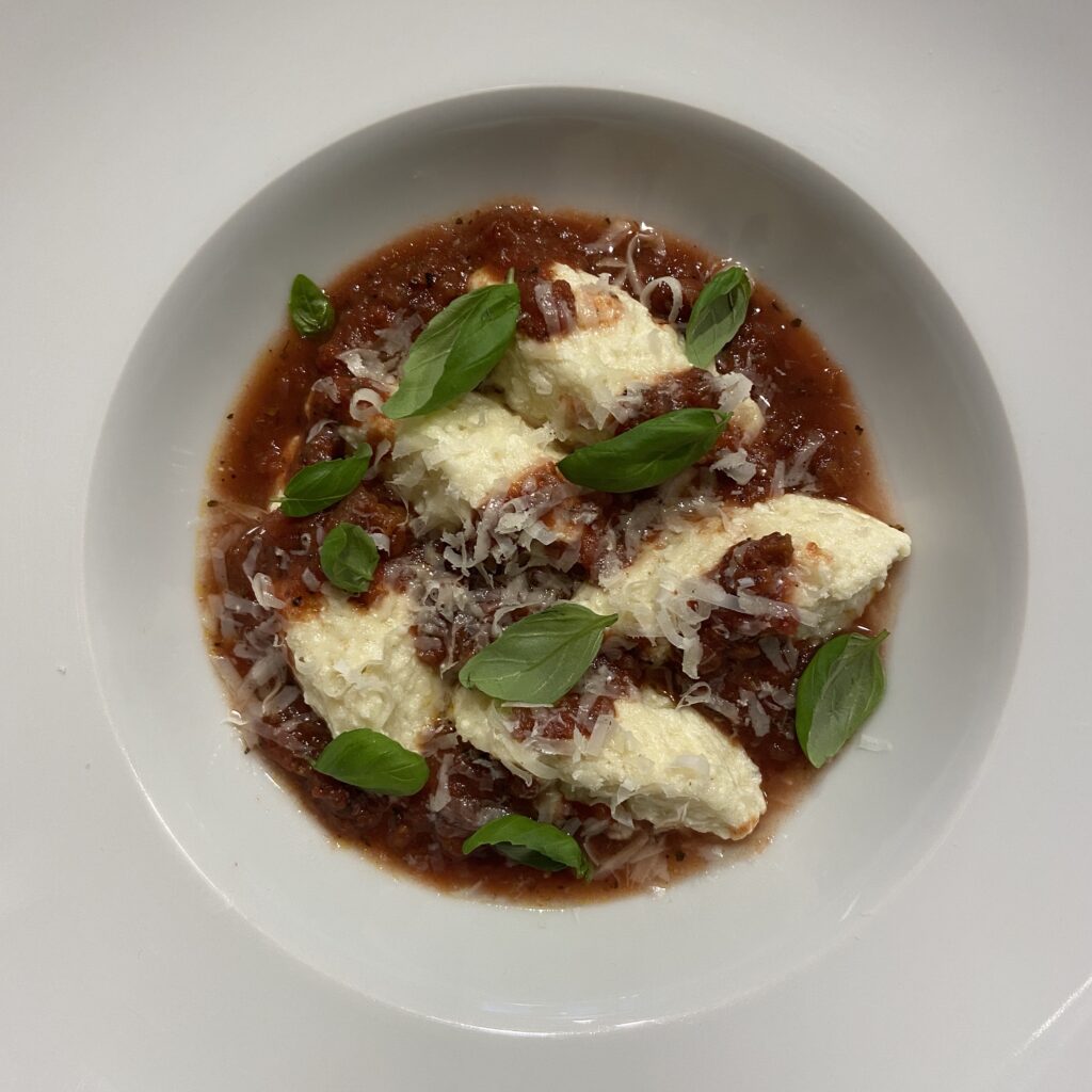 Ricotta Gnudi with Rosemont Pasta Sauce in bowl