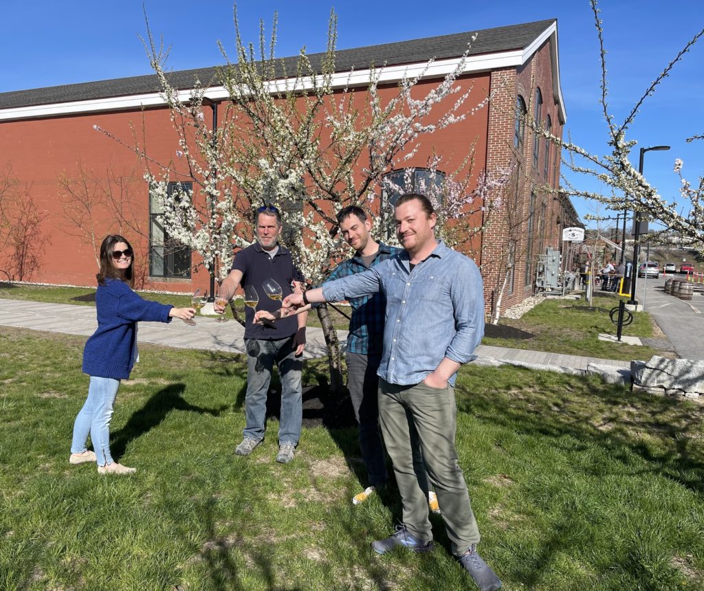 Rosemont Team toasting a glass of wine at Thompson's Point