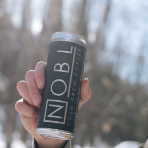 NOBL Beverage Cold Brew in hand